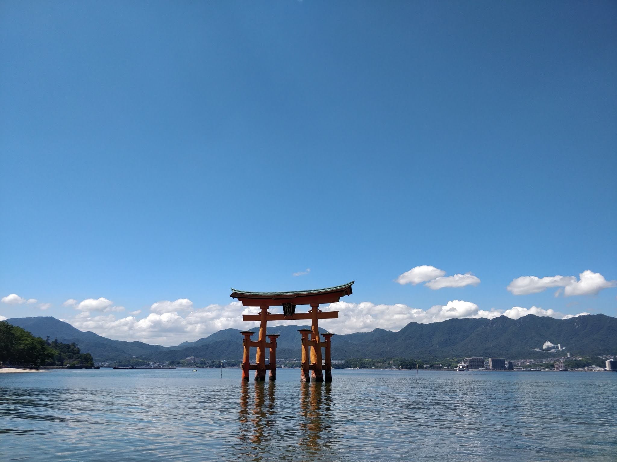 Japanese torii gate at sunset with Mount Fuji in background